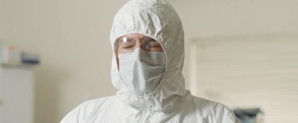 Man wearing PPE suit